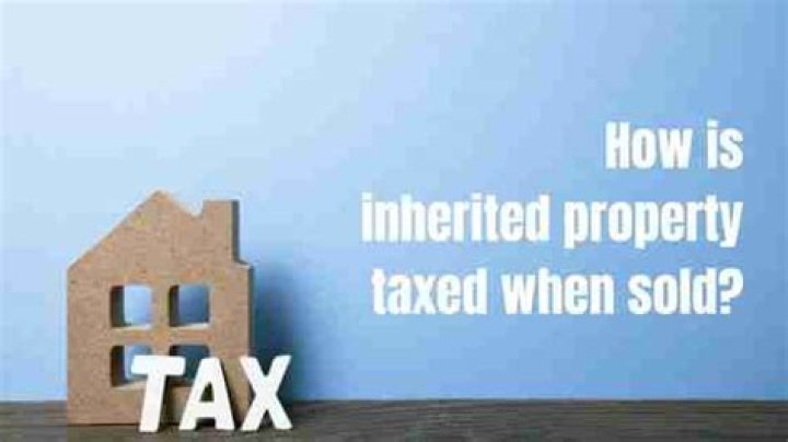How is inherited land taxed when sold?